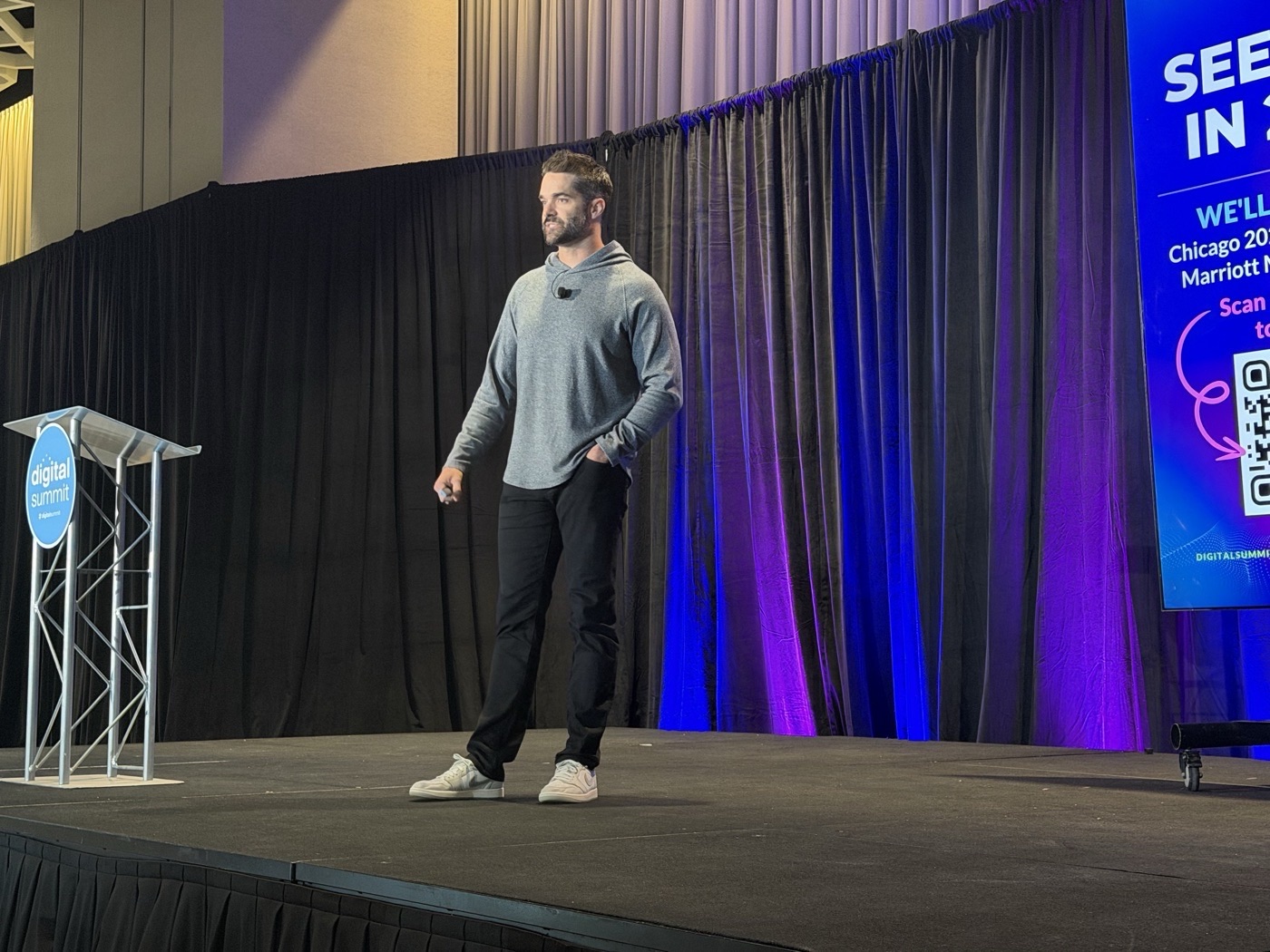 Tyler Lane speaking on stage at Digital Summit